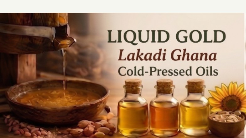 Golden wood pressed oil being poured traditionally