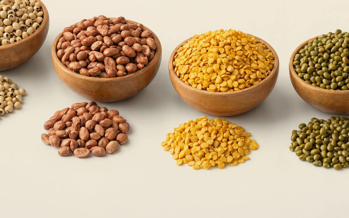 Sattvaved farm grown pulses — groundnuts, toor dal and moong in wooden bowls